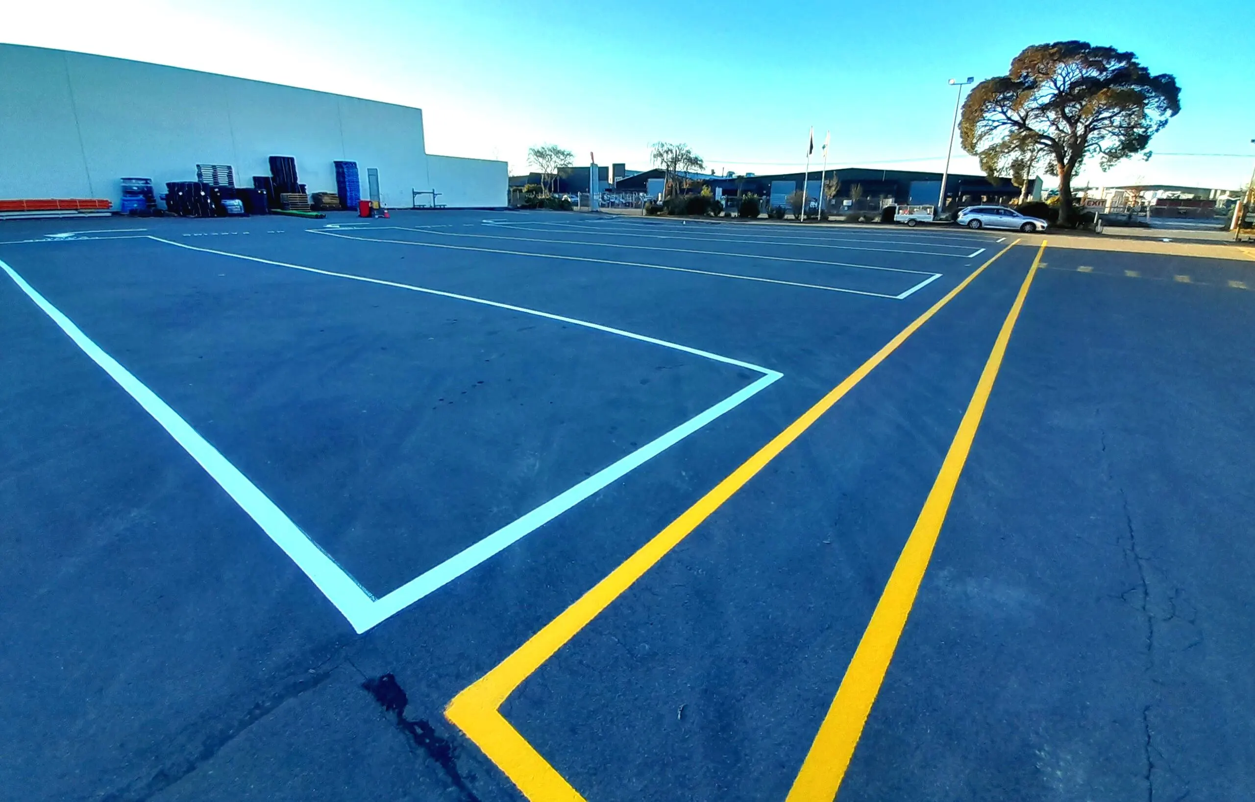 Fresh white and yellow line marking on outdoor carpark